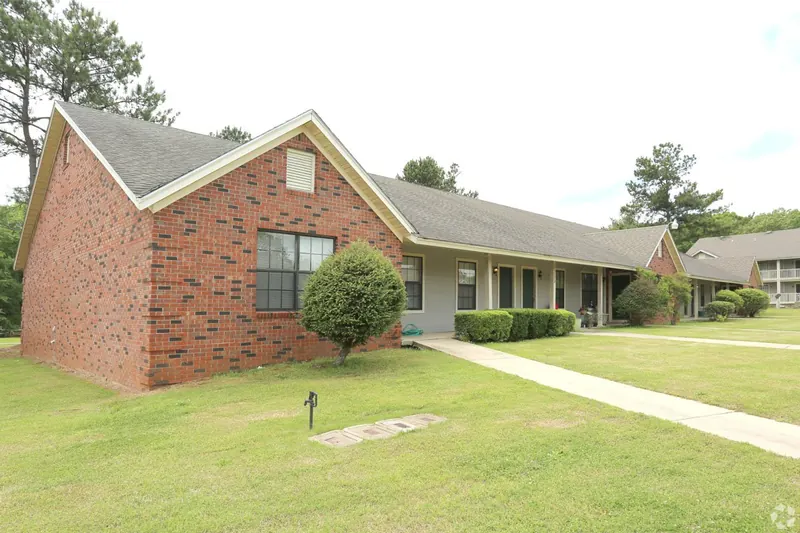 Brick building and landscaped lawn