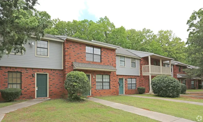 Two-story brick apartment buildings with balconies at Alpine Village